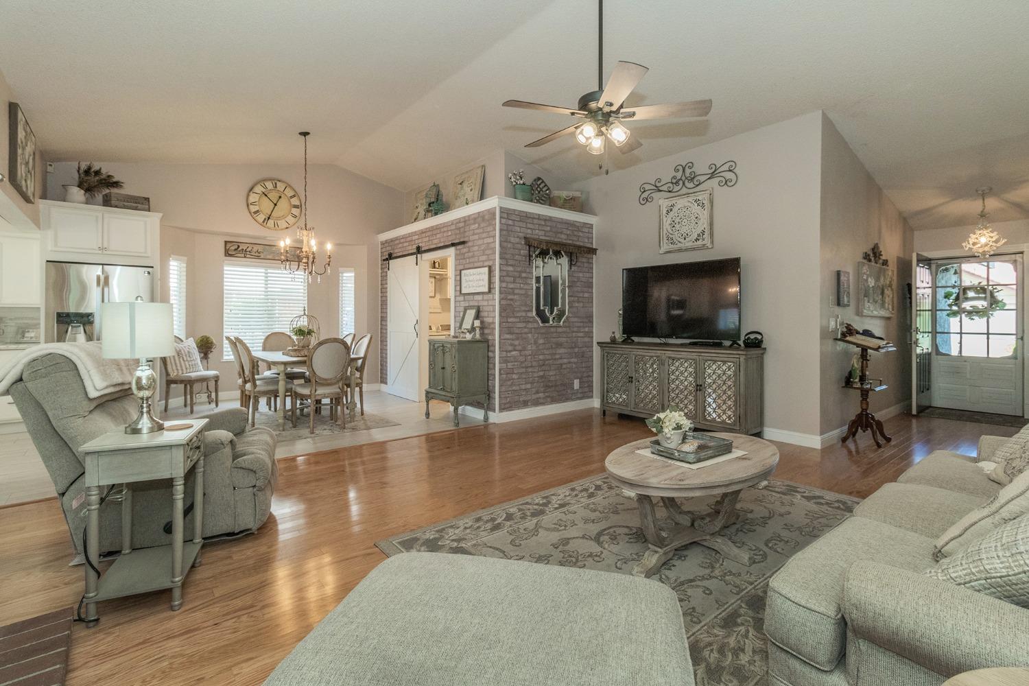 2508 Gibson Avenue Clovis, CA 93611 - Photo 5 of 33 a living room with fireplace furniture and a flat screen tv