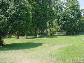 205 Lassiter Farm Road Raleigh, NC 27603 - Photo 3 of 4 a view of a park with trees in the background
