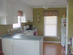 205 Lassiter Farm Road Raleigh, NC 27603 - Photo 4 of 4 a kitchen with a sink and a window