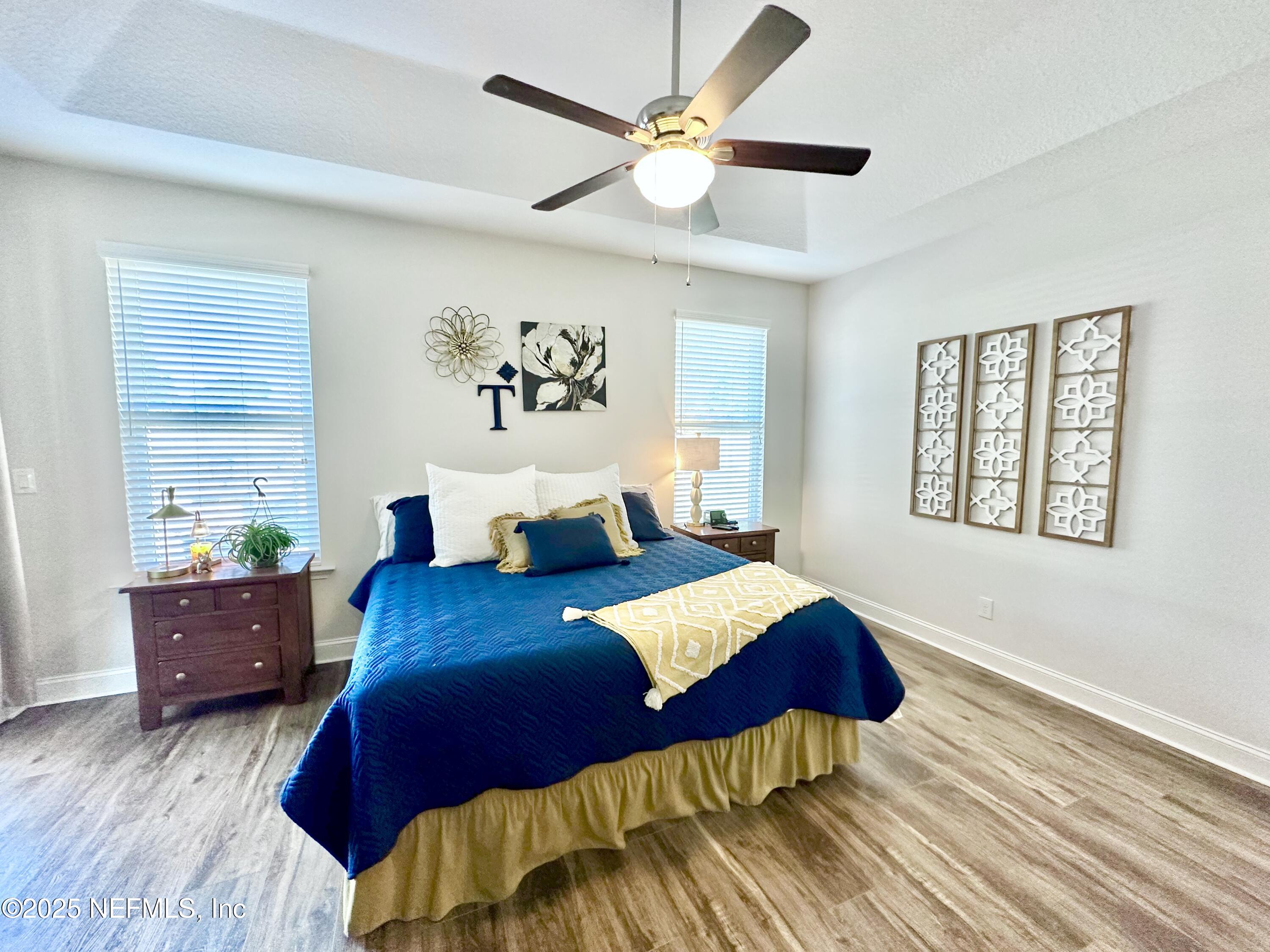 55370 Deer Run Road Callahan, FL 32011 - Photo 16 of 44 a bedroom with a bed and a table