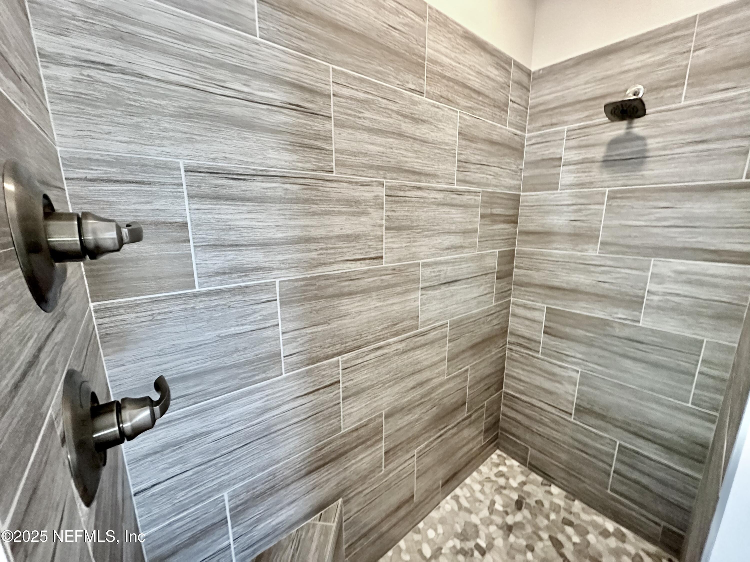 55370 Deer Run Road Callahan, FL 32011 - Photo 19 of 44 a bathroom with a shower