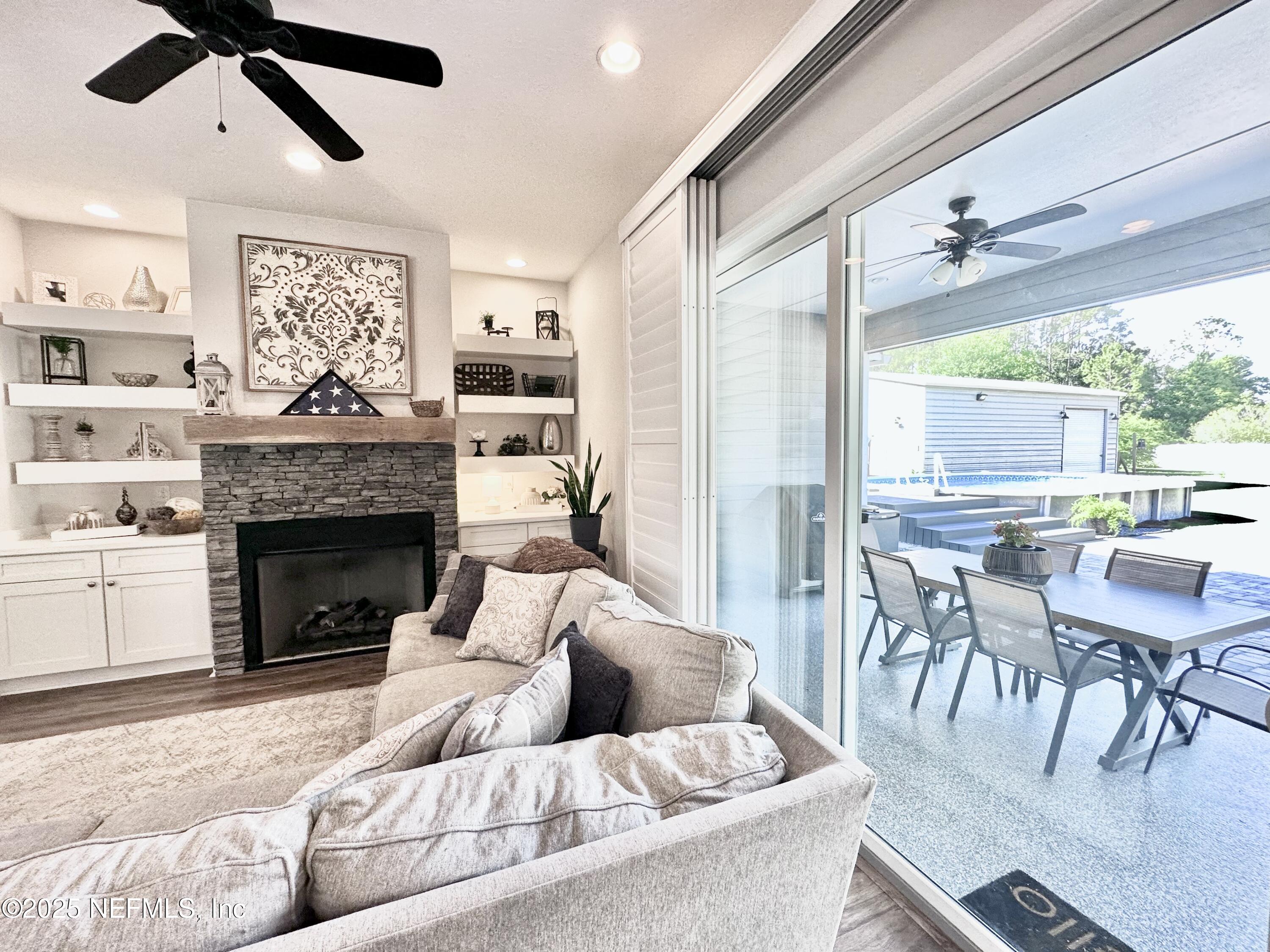 55370 Deer Run Road Callahan, FL 32011 - Photo 25 of 44 a living room with furniture and a fireplace