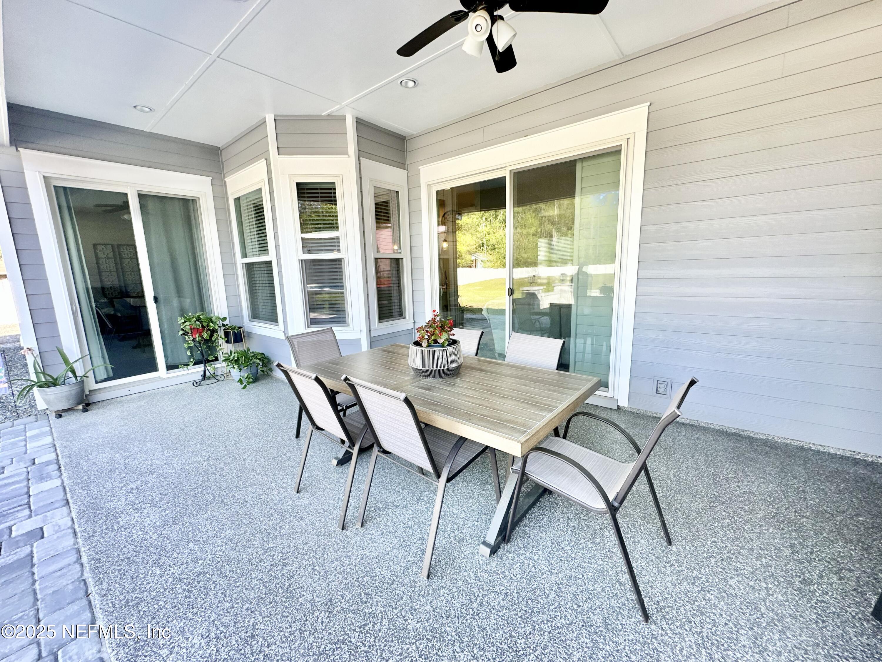 55370 Deer Run Road Callahan, FL 32011 - Photo 26 of 44 a view of a patio with a table and chairs