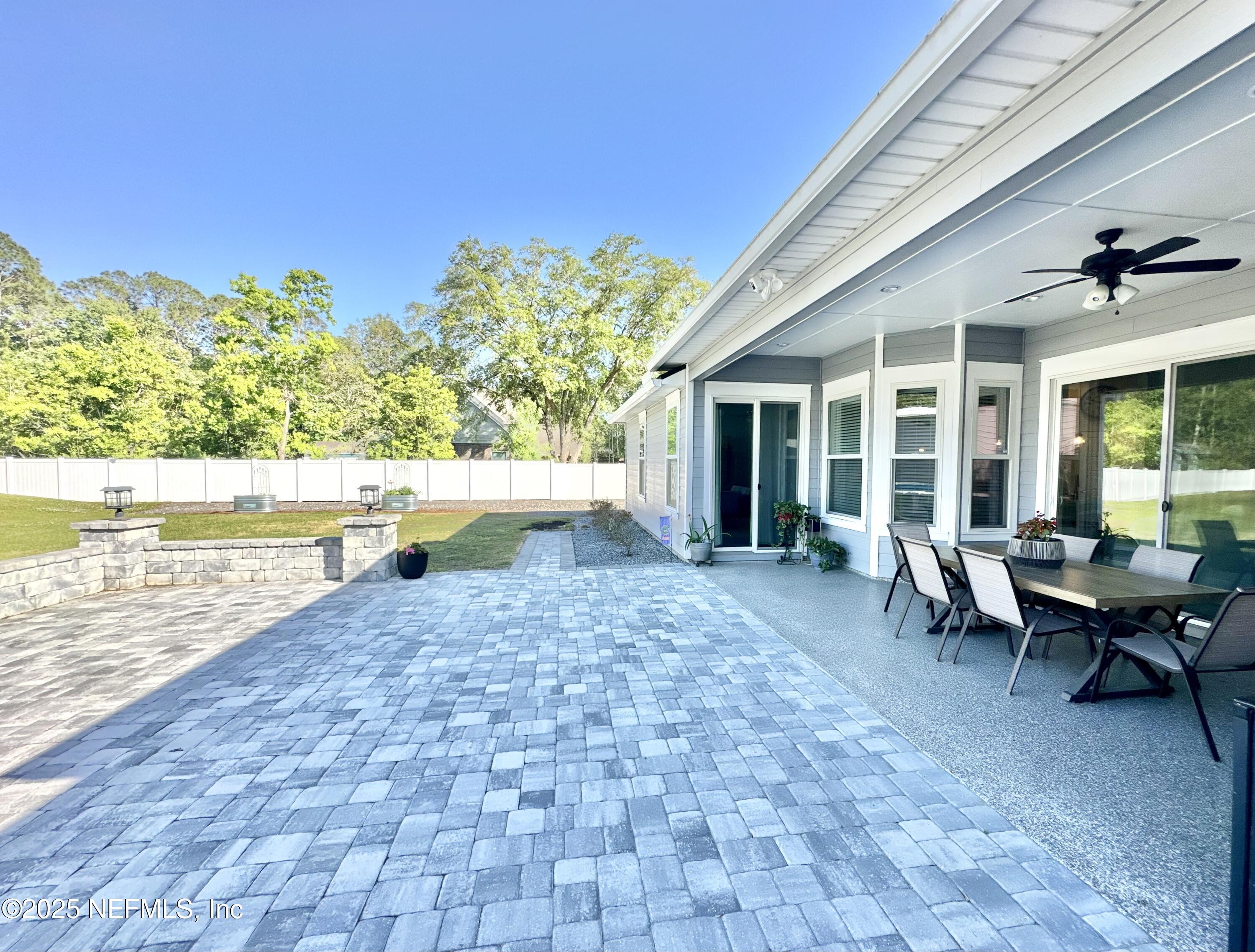 55370 Deer Run Road Callahan, FL 32011 - Photo 28 of 44 a backyard of a house with outdoor seating