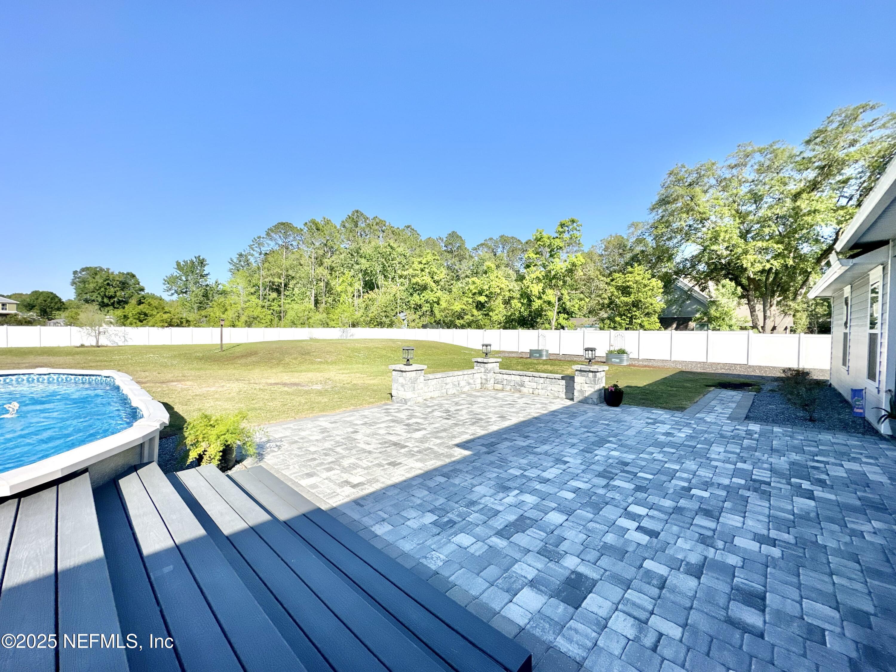 55370 Deer Run Road Callahan, FL 32011 - Photo 30 of 44 a view of swimming pool with an outdoor space