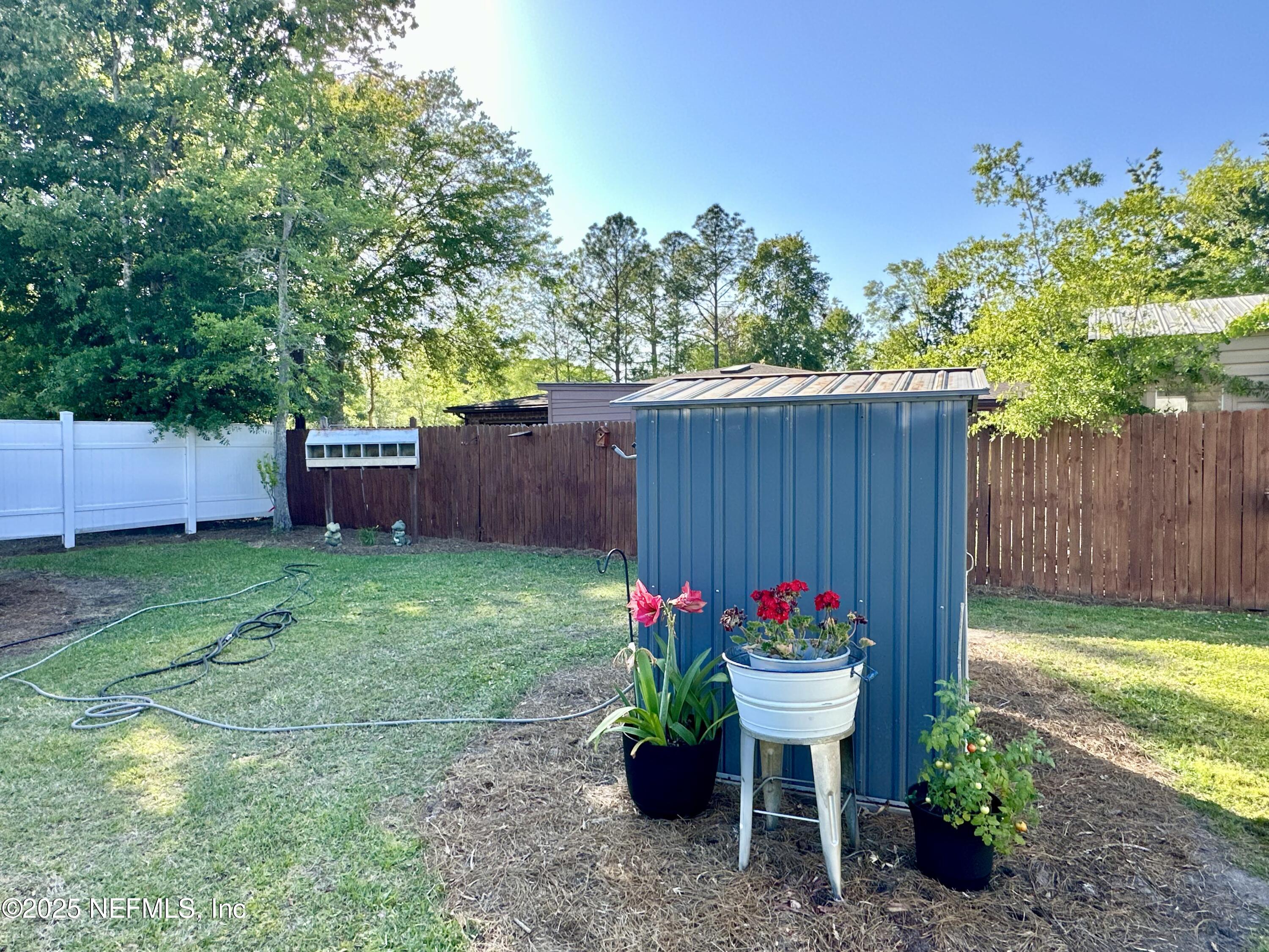 55370 Deer Run Road Callahan, FL 32011 - Photo 35 of 44 a view of a backyard with a garden and plants