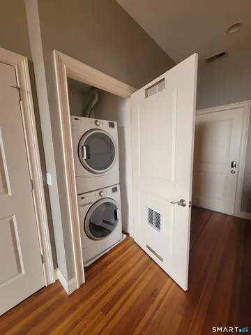 a view of a hallway with washer and dryer