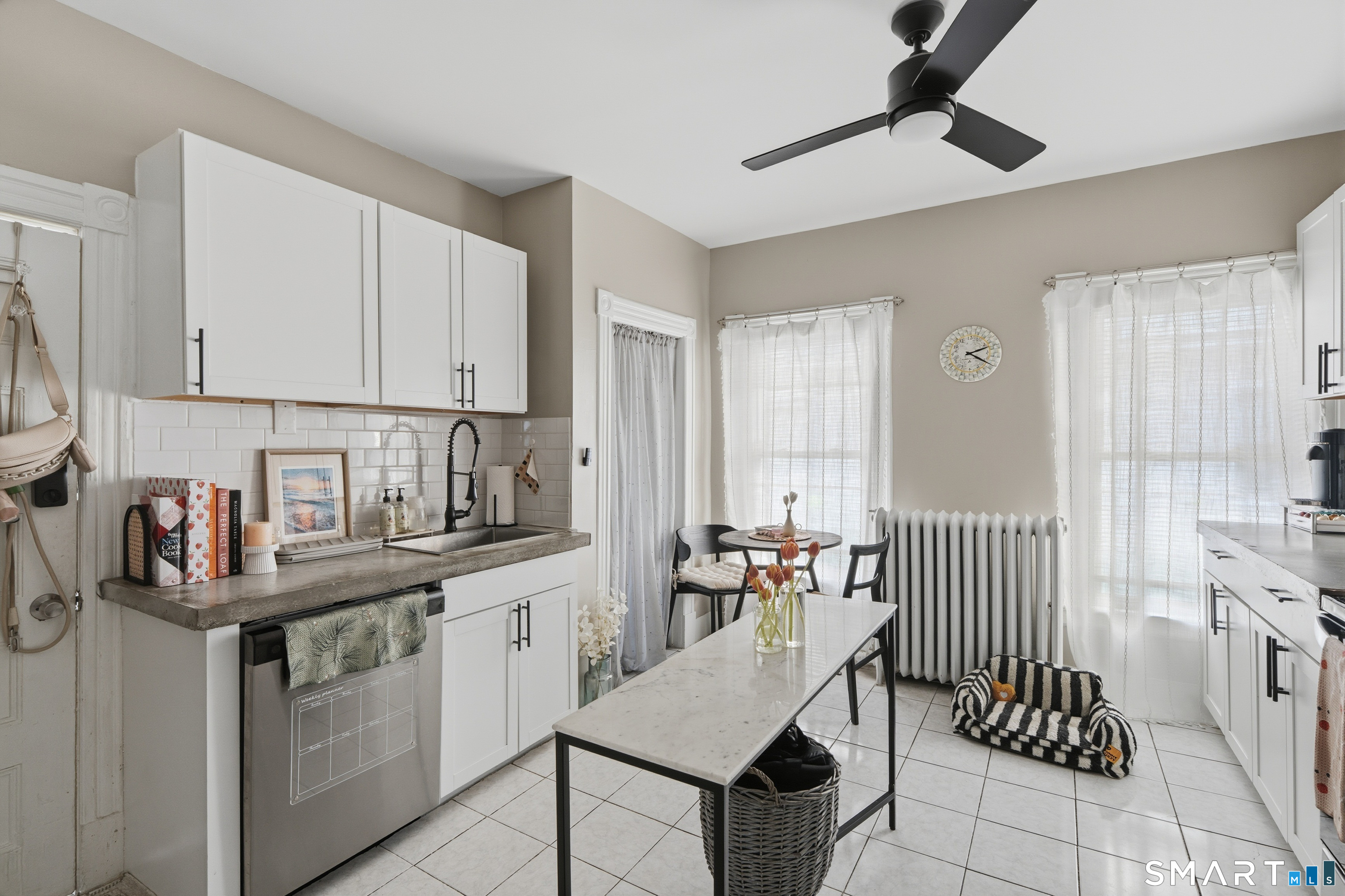 186 Arnoldale Road West Hartford, CT 06119 - Photo 16 of 22 a kitchen with a sink cabinets and window