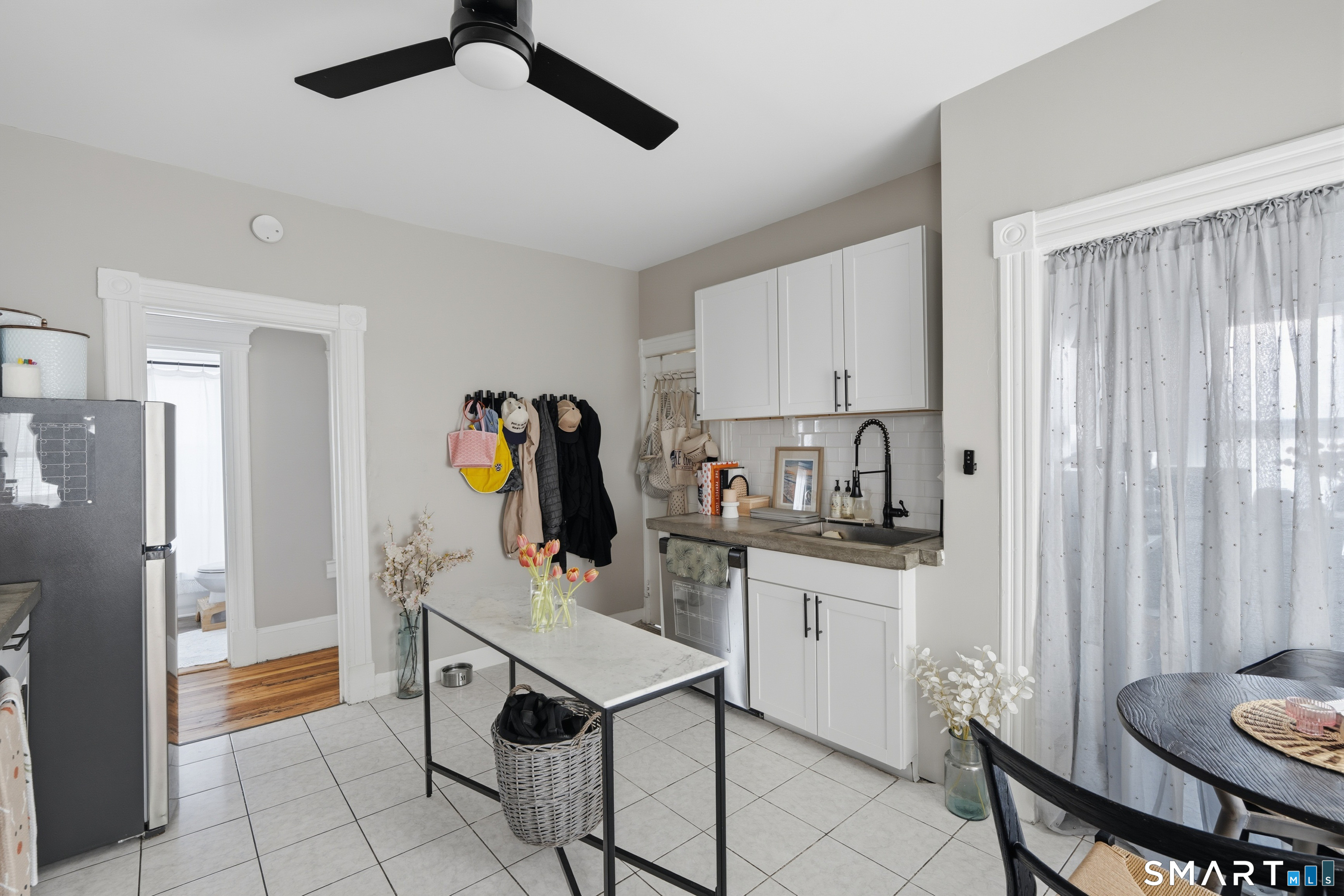 186 Arnoldale Road West Hartford, CT 06119 - Photo 18 of 22 a kitchen with stainless steel appliances a stove a refrigerator and a dining table