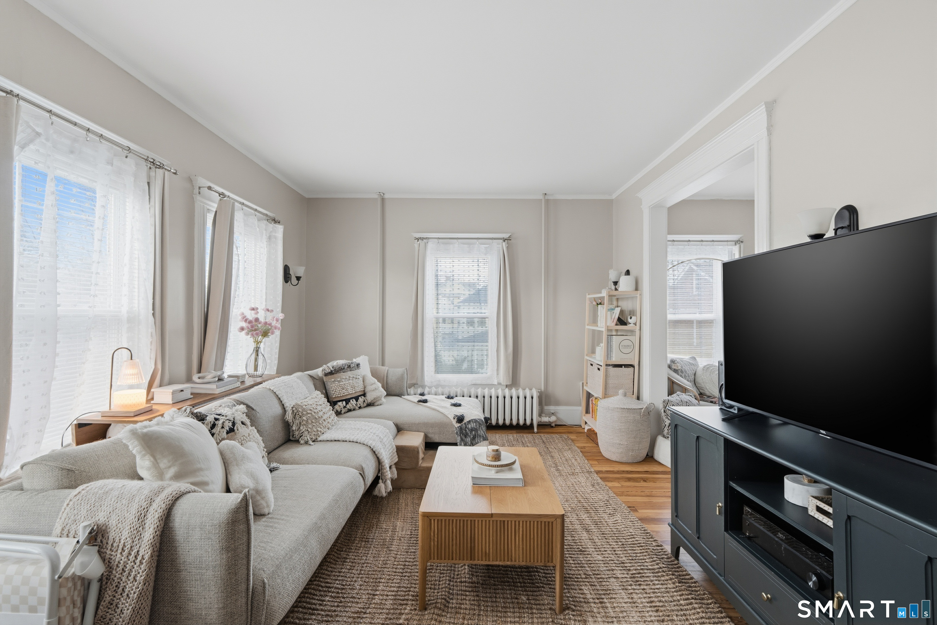 186 Arnoldale Road West Hartford, CT 06119 - Photo 2 of 22 a living room with furniture and a flat screen tv