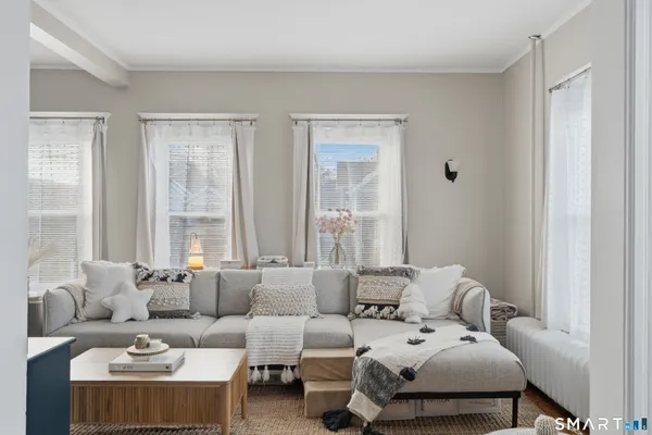 a bedroom with furniture and windows