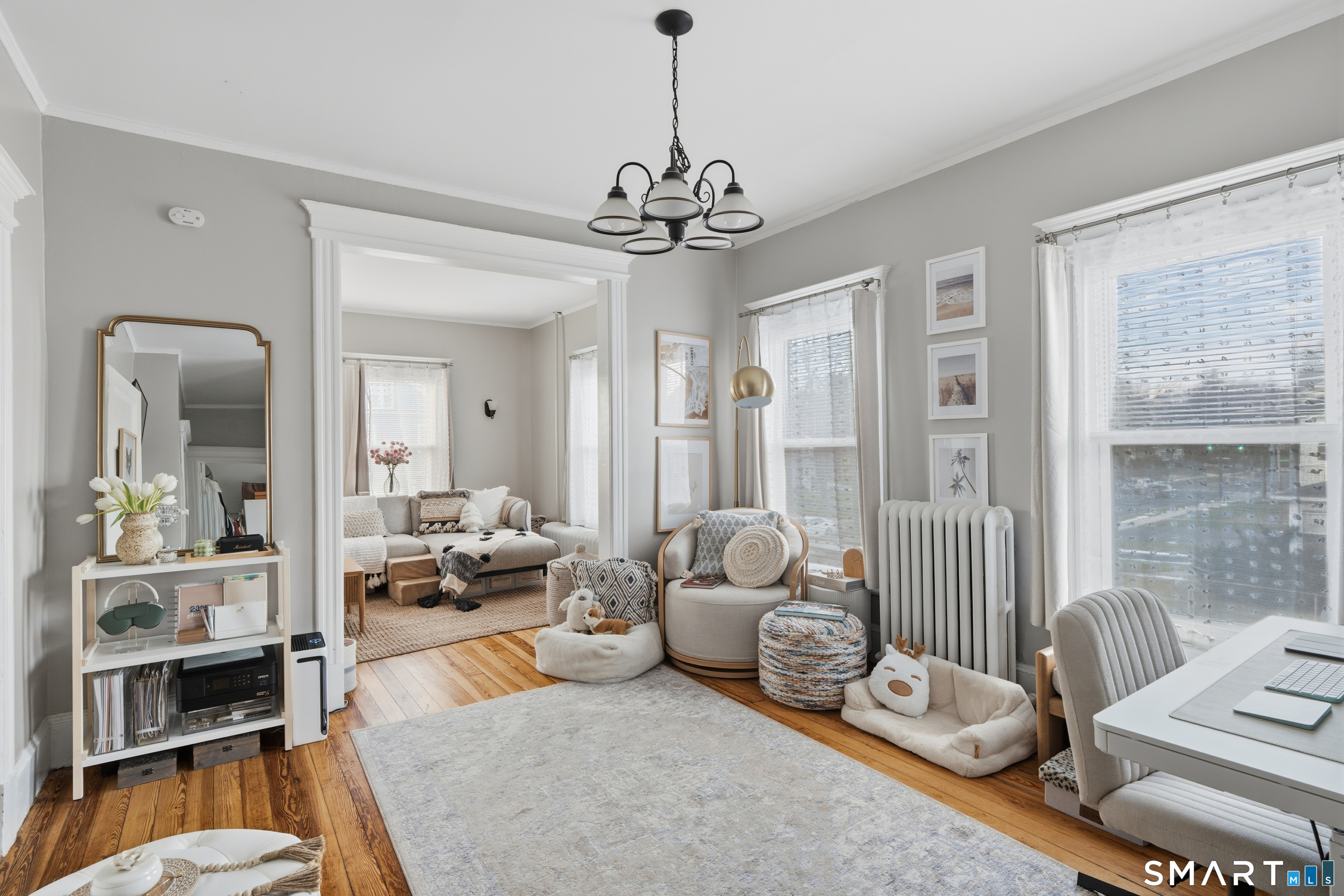 186 Arnoldale Road West Hartford, CT 06119 - Photo 6 of 22 a living room with furniture and a chandelier
