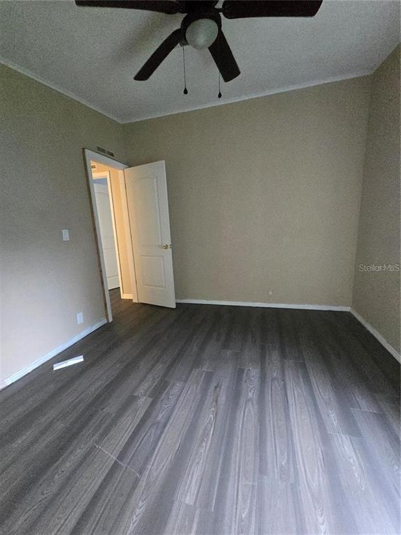 208 Pine Tree Trail Crescent City, FL 32112 - Photo 11 of 16 wooden floor in an empty room