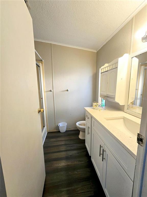 208 Pine Tree Trail Crescent City, FL 32112 - Photo 16 of 16 a bathroom with a sink a toilet and shower