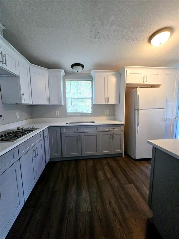 208 Pine Tree Trail Crescent City, FL 32112 - Photo 7 of 16 a kitchen with sink cabinets and window