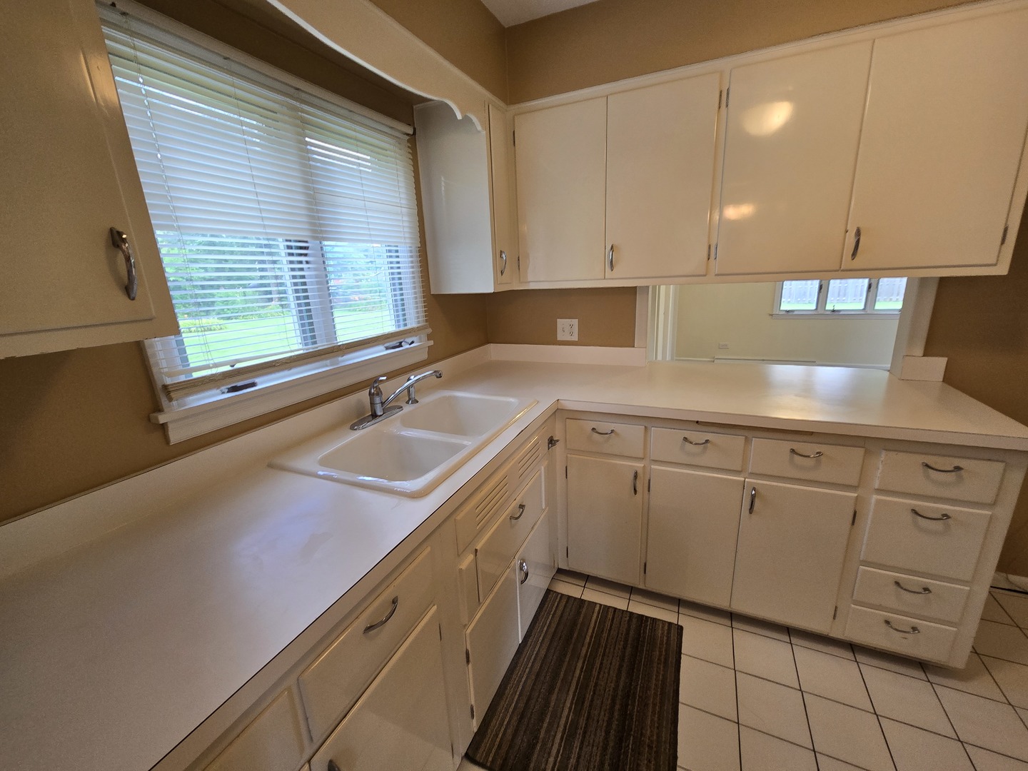 3620 Arthur Terrace Markham, IL 60428 - Photo 9 of 31 a kitchen with a sink cabinets and window