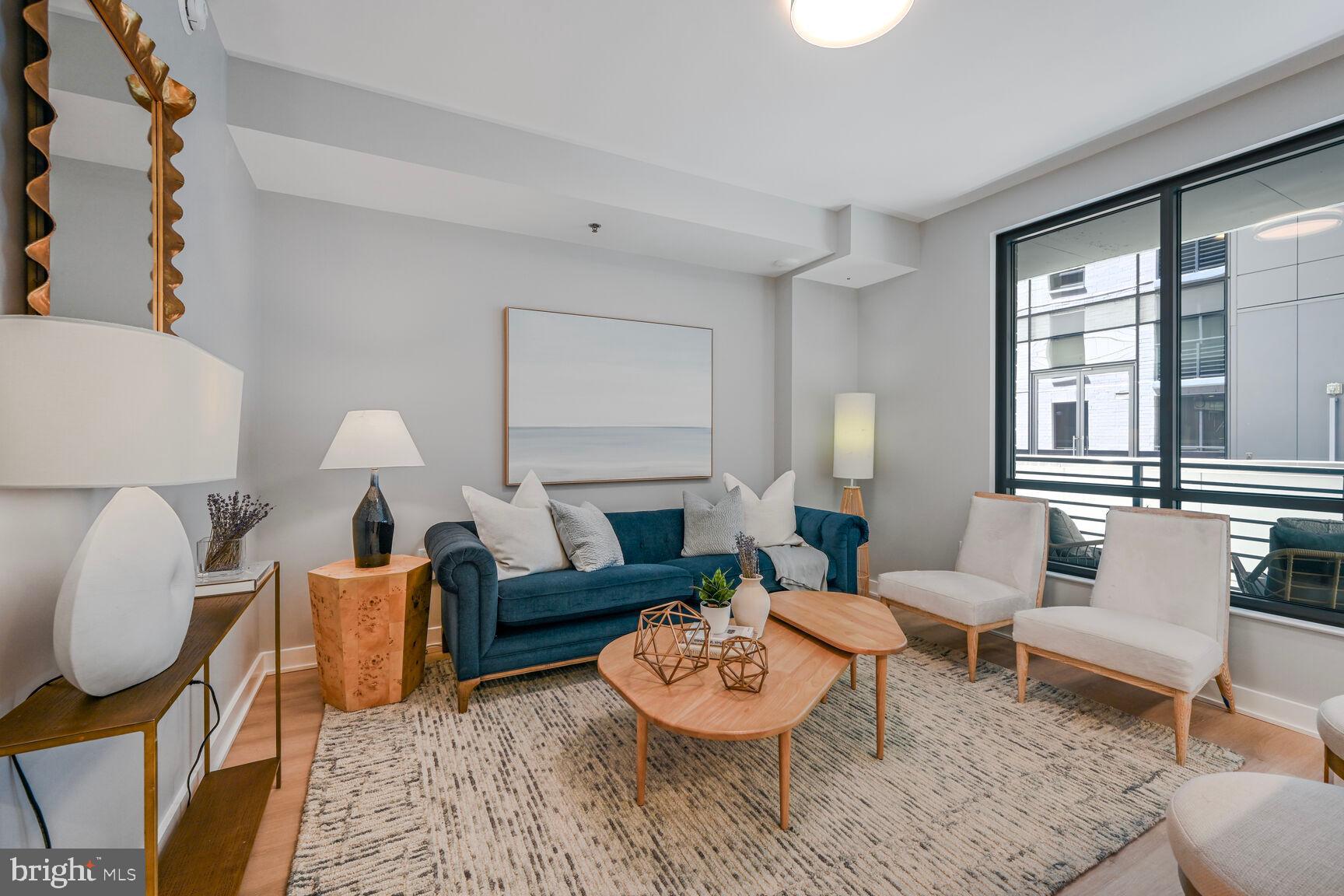 950 3rd Street Northwest, Unit 305 Washington, DC 20001 - Photo 23 of 31 a living room with furniture and a large window