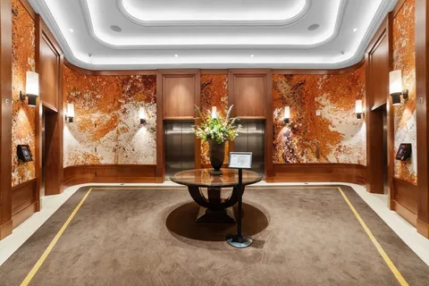 a view of a living room with a large window and floor to ceiling window