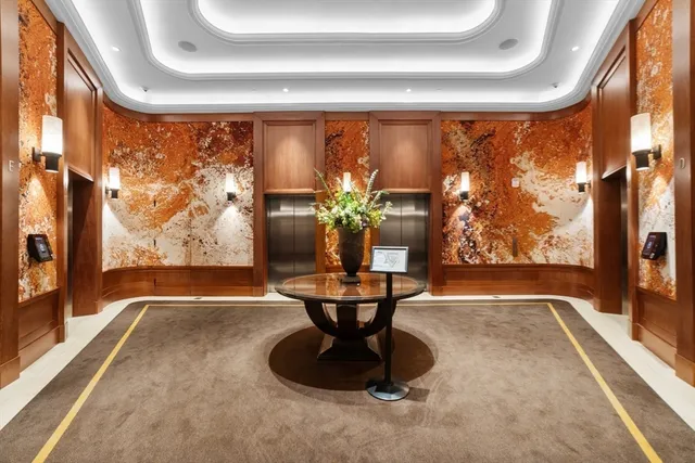 a view of a living room with a large window and floor to ceiling window