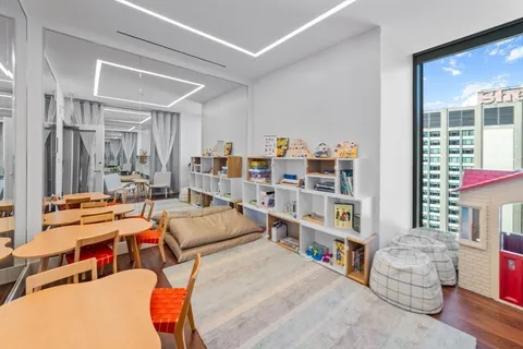 a room with furniture and a book shelf