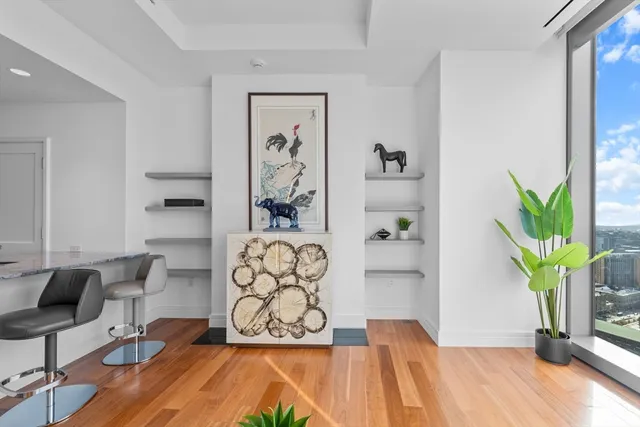 a view of living room with furniture and wooden floor