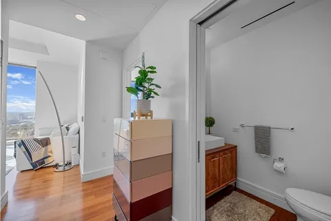 a room with furniture and a potted plant