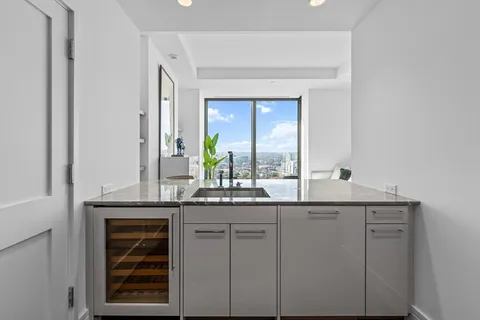 a kitchen with cabinets and window