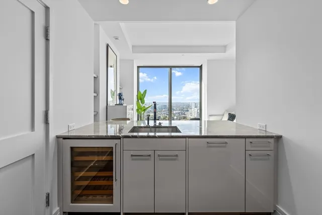 a kitchen with cabinets and window