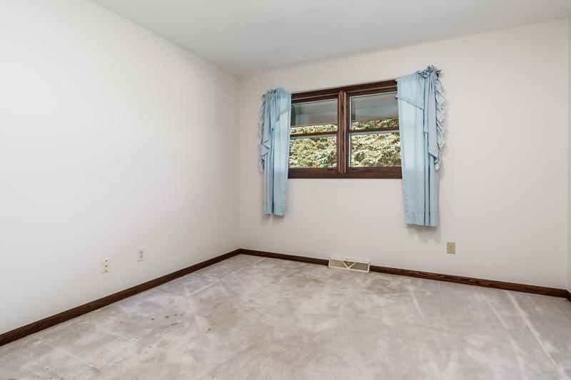 11371 Corrigan Road Roscoe, IL 61073 - Photo 32 of 85 an empty room with windows
