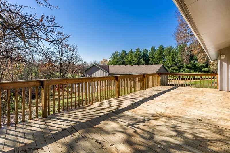 11371 Corrigan Road Roscoe, IL 61073 - Photo 49 of 85 a view of a street with a wooden fence