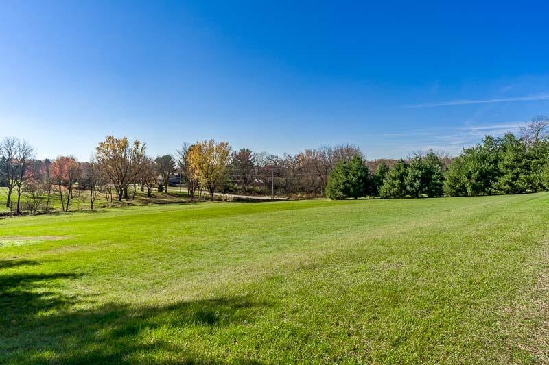 11371 Corrigan Road Roscoe, IL 61073 - Photo 54 of 85 a view of a field of grass and trees