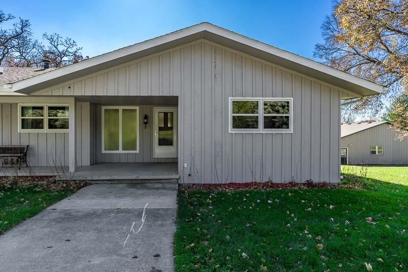 11371 Corrigan Road Roscoe, IL 61073 - Photo 6 of 85 a front view of a house with garden