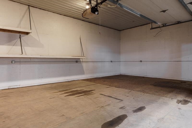 11371 Corrigan Road Roscoe, IL 61073 - Photo 67 of 85 a view of a room with racks on the wall