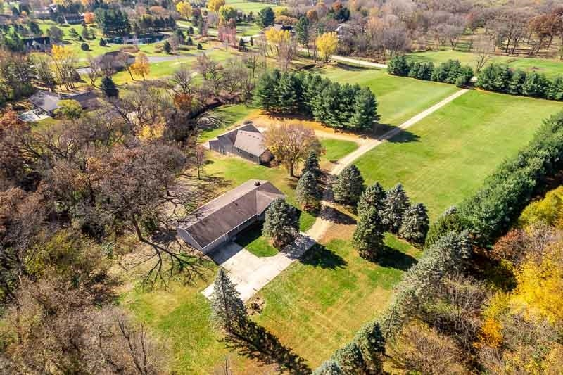 11371 Corrigan Road Roscoe, IL 61073 - Photo 80 of 85 an aerial view of residential houses with outdoor space and swimming pool