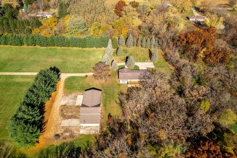 11371 Corrigan Road Roscoe, IL 61073 - Photo 83 of 85 an aerial view of a house with a yard and lake view