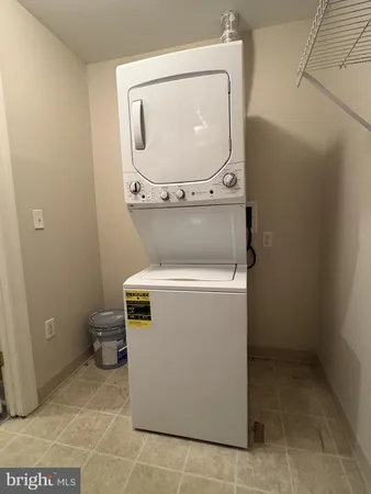 a room with water heater and refrigerator