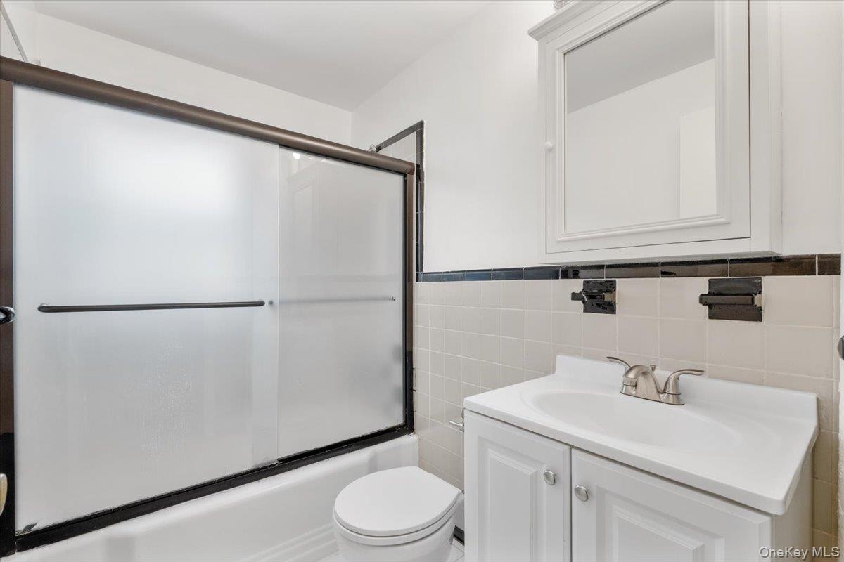 15 Chestnut Street, Unit 6A Rye, NY 10580 - Photo 13 of 27 a bathroom with a sink a toilet and vanity