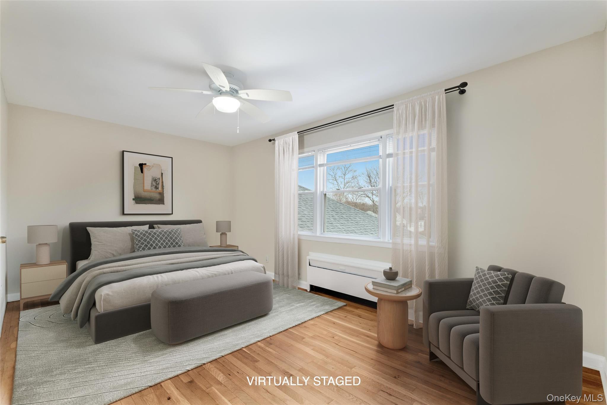 15 Chestnut Street, Unit 6A Rye, NY 10580 - Photo 14 of 27 a bedroom with a bed and a couch