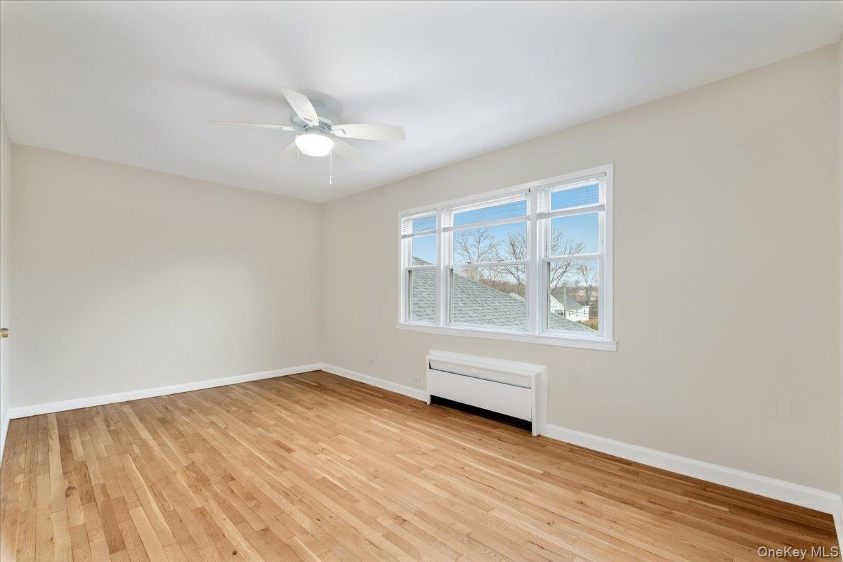 15 Chestnut Street, Unit 6A Rye, NY 10580 - Photo 15 of 27 wooden floor in an empty room with a window
