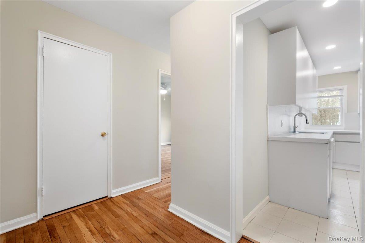 15 Chestnut Street, Unit 6A Rye, NY 10580 - Photo 2 of 27 a room with white cabinets and wooden floor