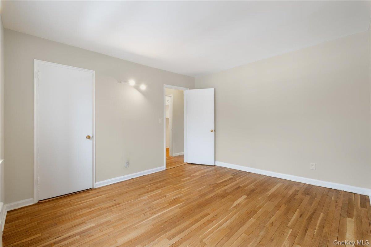 15 Chestnut Street, Unit 6A Rye, NY 10580 - Photo 21 of 27 a view of an empty room with wooden floor