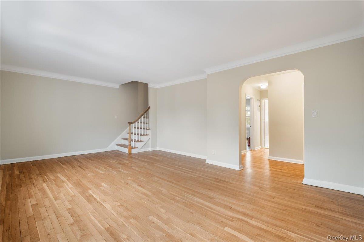 15 Chestnut Street, Unit 6A Rye, NY 10580 - Photo 6 of 27 a view of an empty room with wooden floor and a window