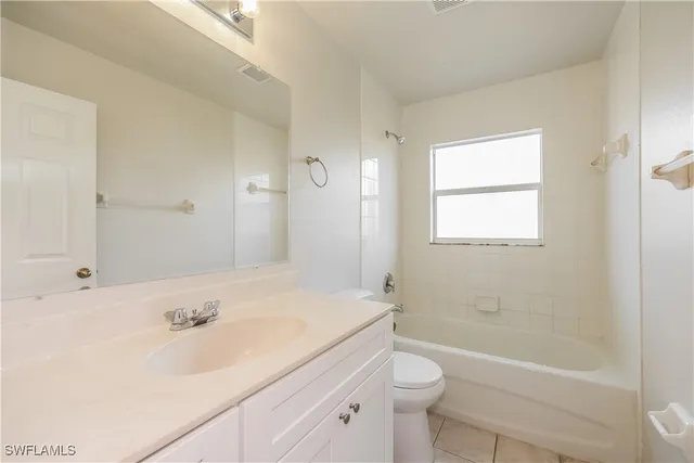 a bathroom with a sink a toilet and a bathtub