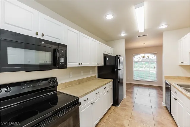 a kitchen with a stove and a microwave