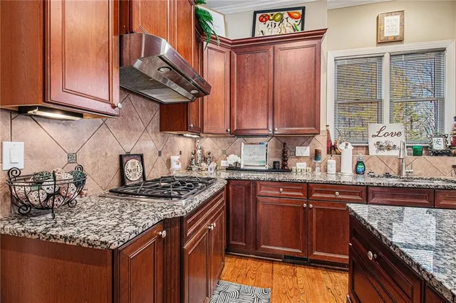 a bathroom with a sink toilet and a mirror