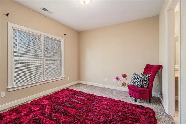 a view of a hallway with wooden floor and stairs