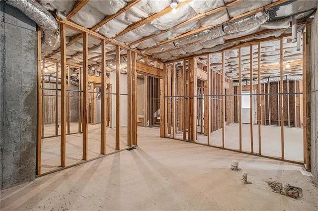 an aerial view of a house with garden space and street view