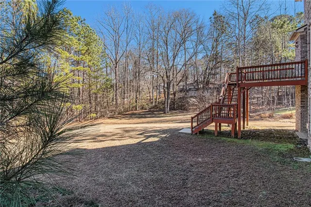 a backyard of a house with lots of green space