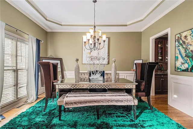 a living room with kitchen island furniture and a large window