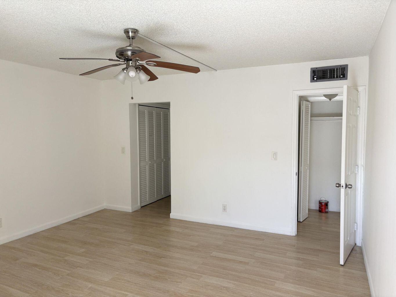 642 Northwest 13th Street, Unit 210 Boca Raton, FL 33486 - Photo 7 of 17 a view of a room with wooden floor